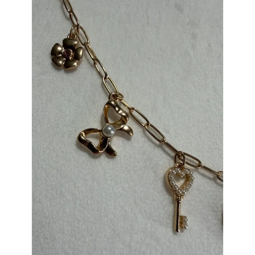 Packed Party Gold-Tone Heart & Charm Necklace with Pink Bow Accent